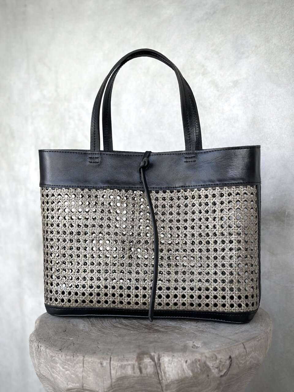 FRANKLIN black leather & blackwash rattan bag