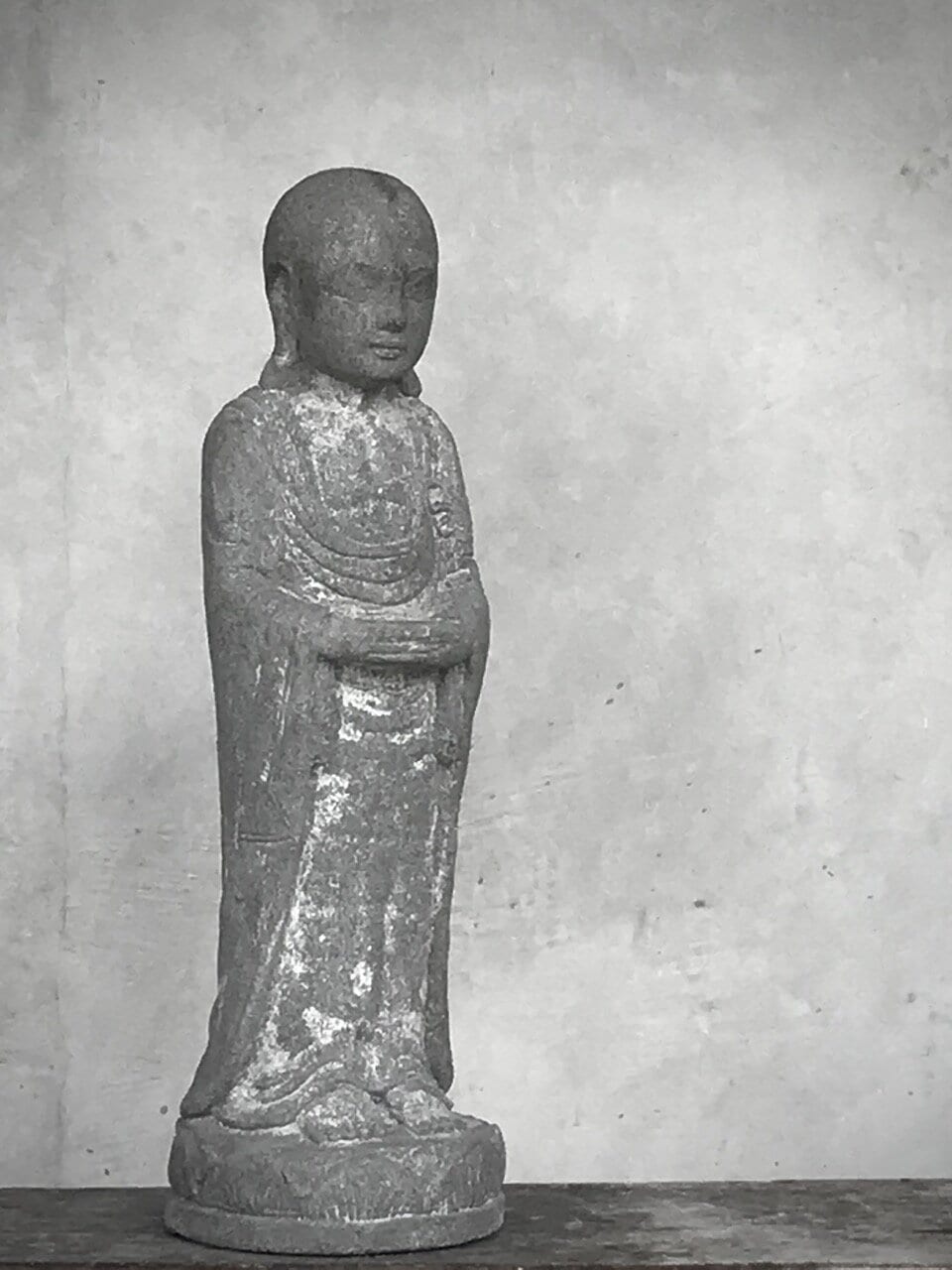 STANDING BUDDHA, antique grey stone