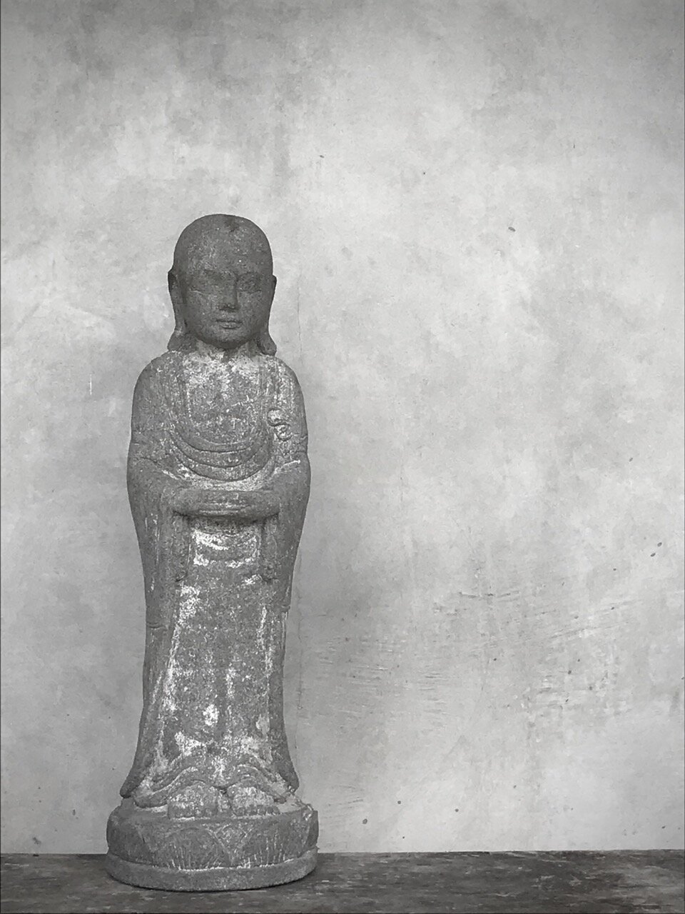 STANDING BUDDHA, antique grey stone