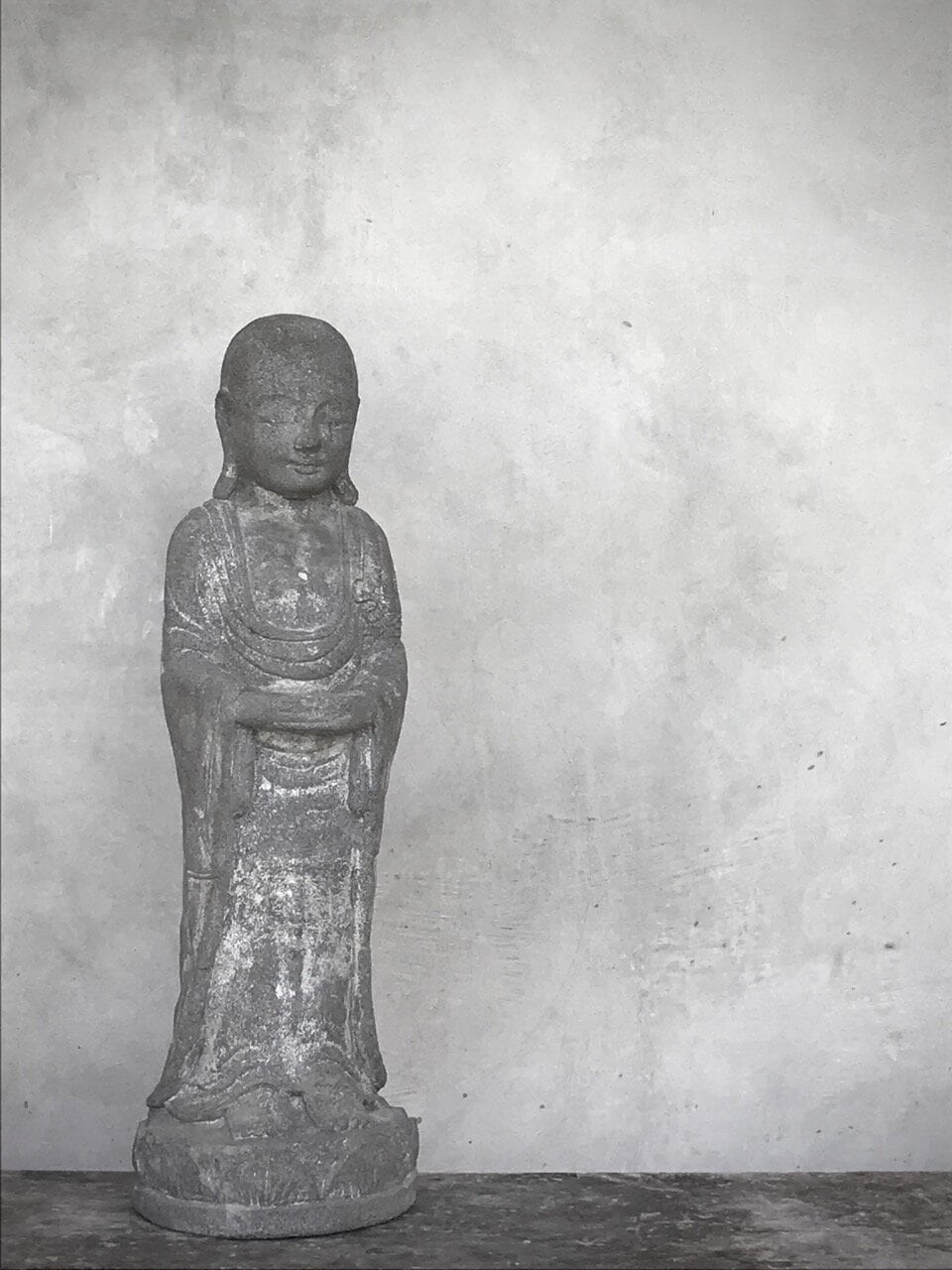 STANDING BUDDHA, antique grey stone